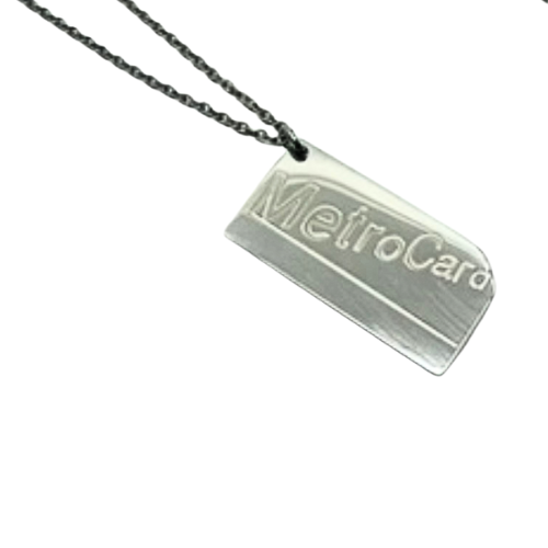 Metallic pendant with 'MetroCard' text on a chain against a white background