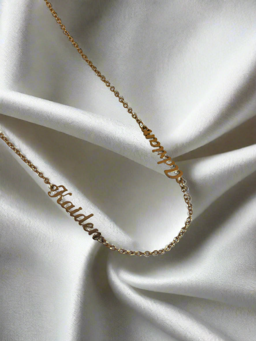 two name chain perfect for gifting on a white fabric