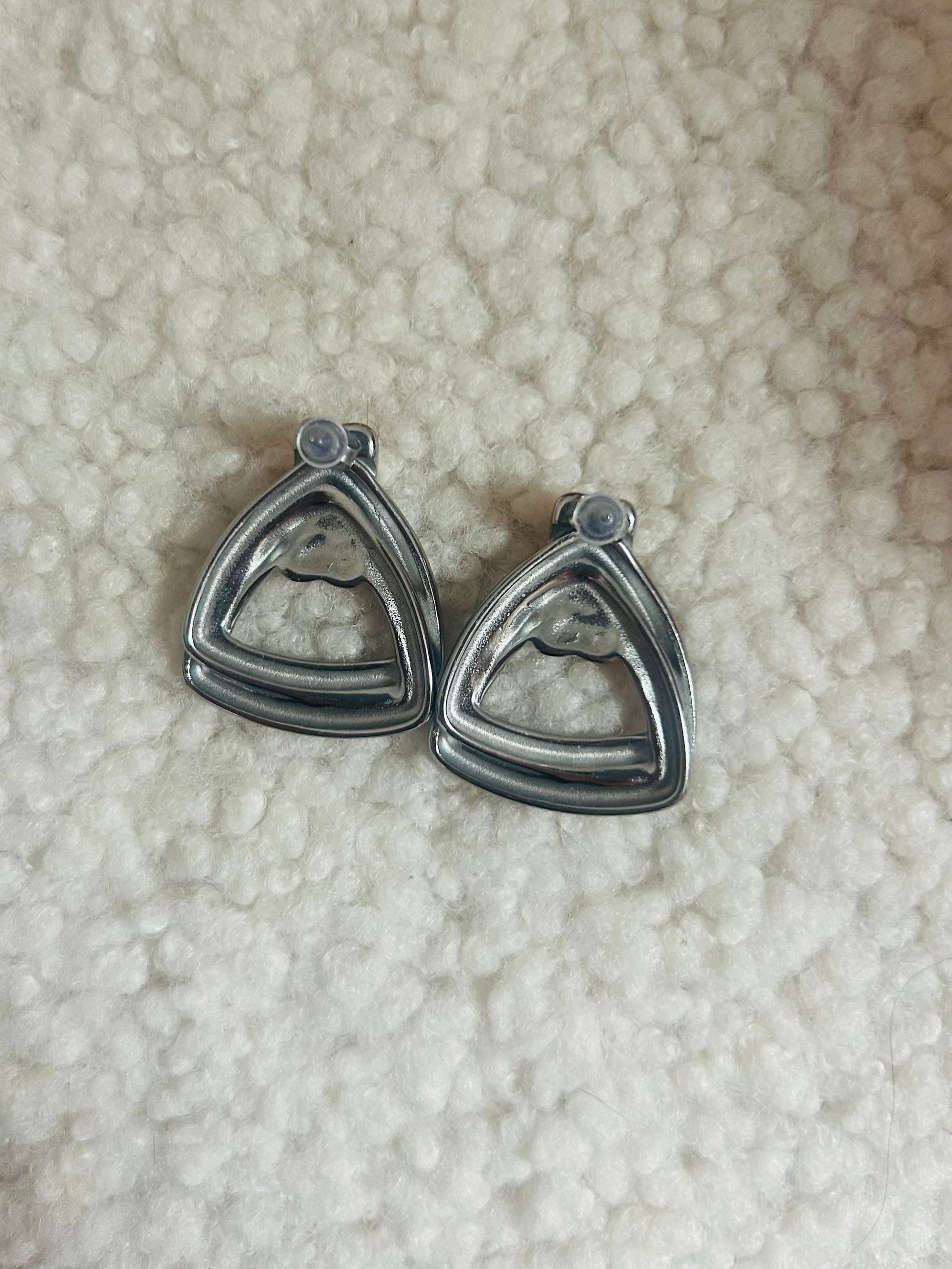 Close-up of chunky silver dome earrings – modern vintage jewelry