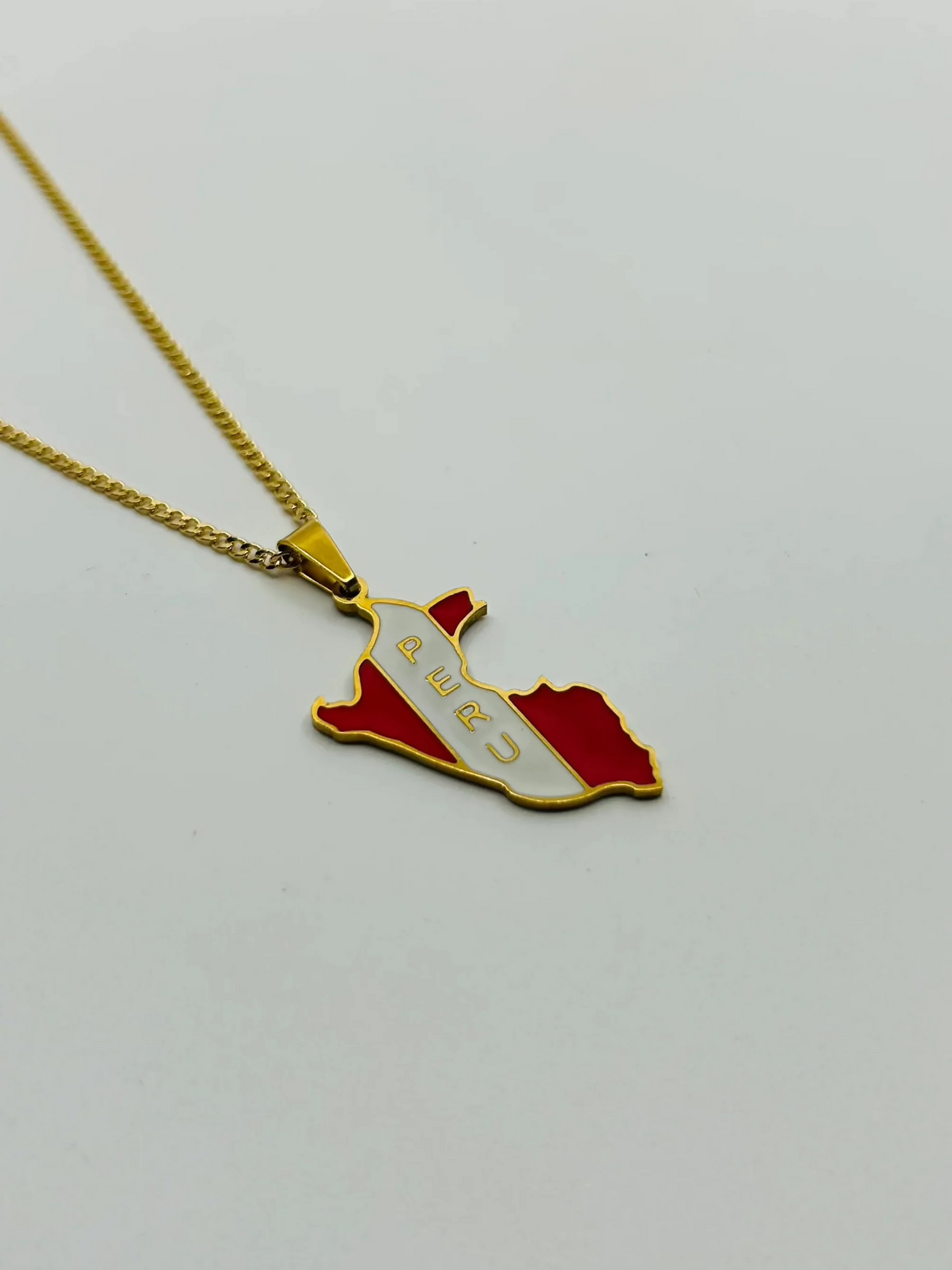 Close-up of engraveable Peru map pendant on gold chain