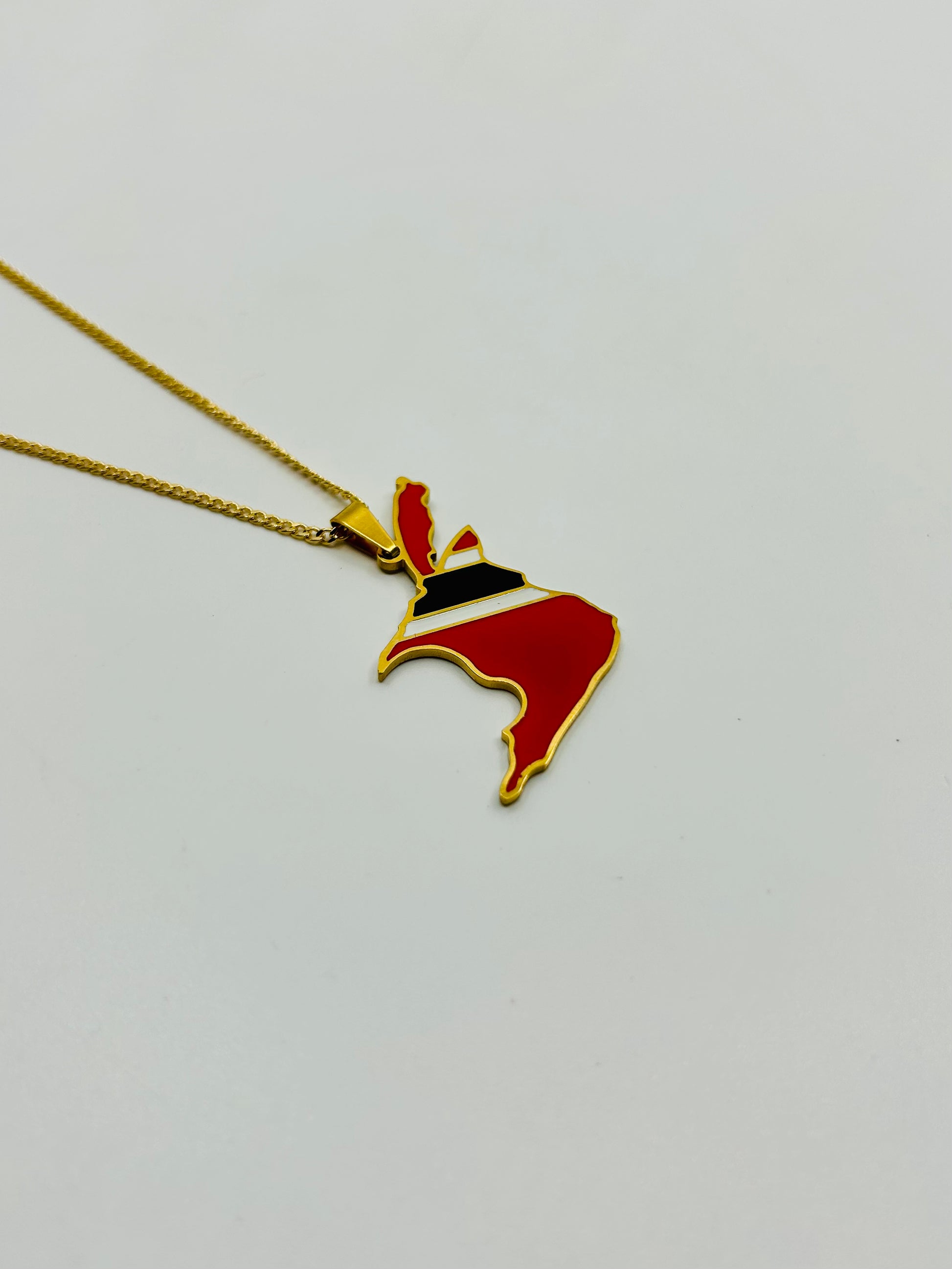 Close-up of gold Trini map necklace – stainless steel pendant