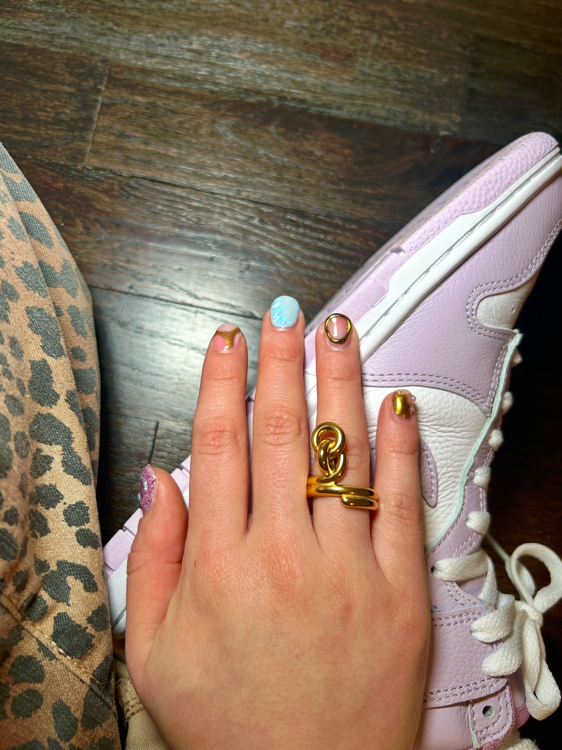 Gold-plated knot ring symbolizing love and unity – worn on hand