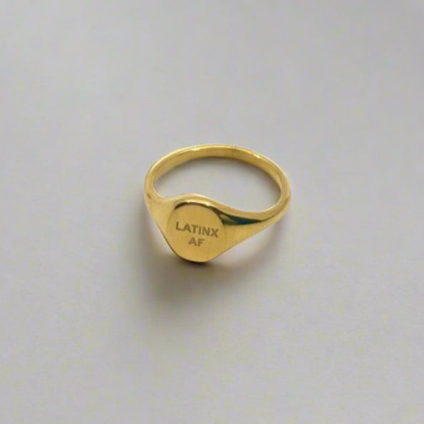 Close-up of Latinx AF gold ring – stainless steel, tarnish-free