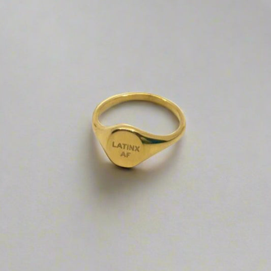 Close-up of Latinx AF gold ring – stainless steel, tarnish-free