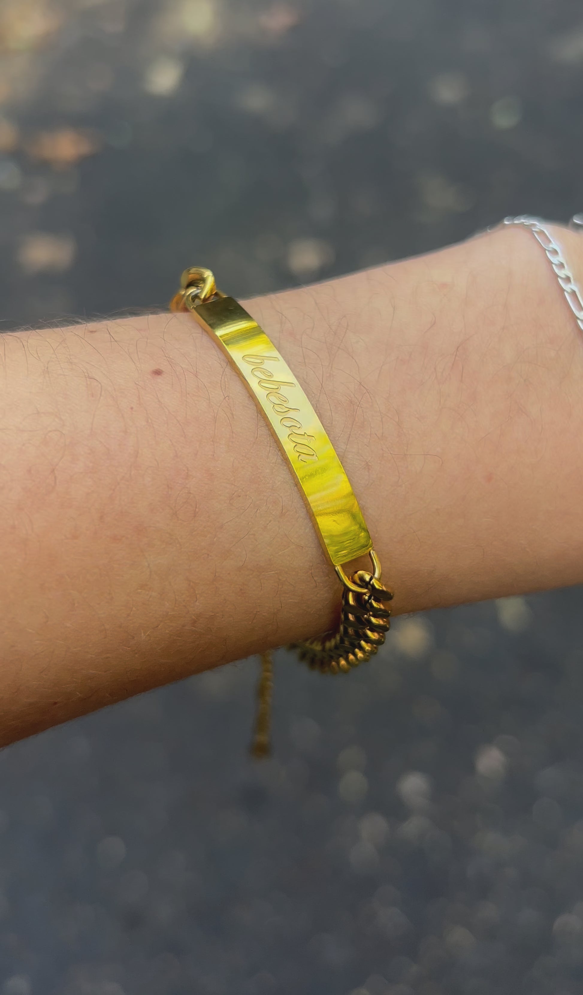 Gold Bebesota nameplate bracelet on model wrist – waterproof jewelry