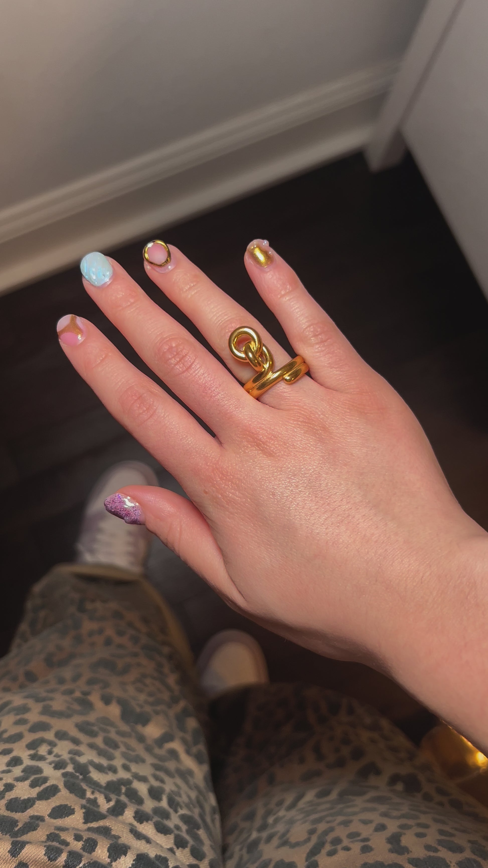 Flat lay of knot ring on fabric – waterproof, tarnish-free jewelry