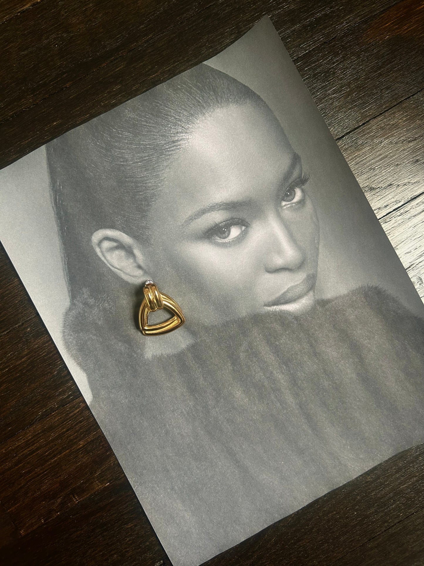 Gold-plated vintage-style earrings styled with minimal makeup and clean outfit