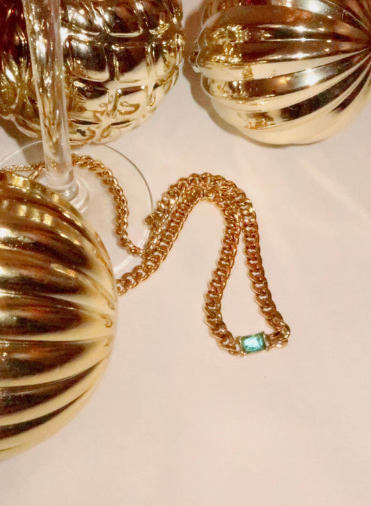 Gold choker necklace with blue stone