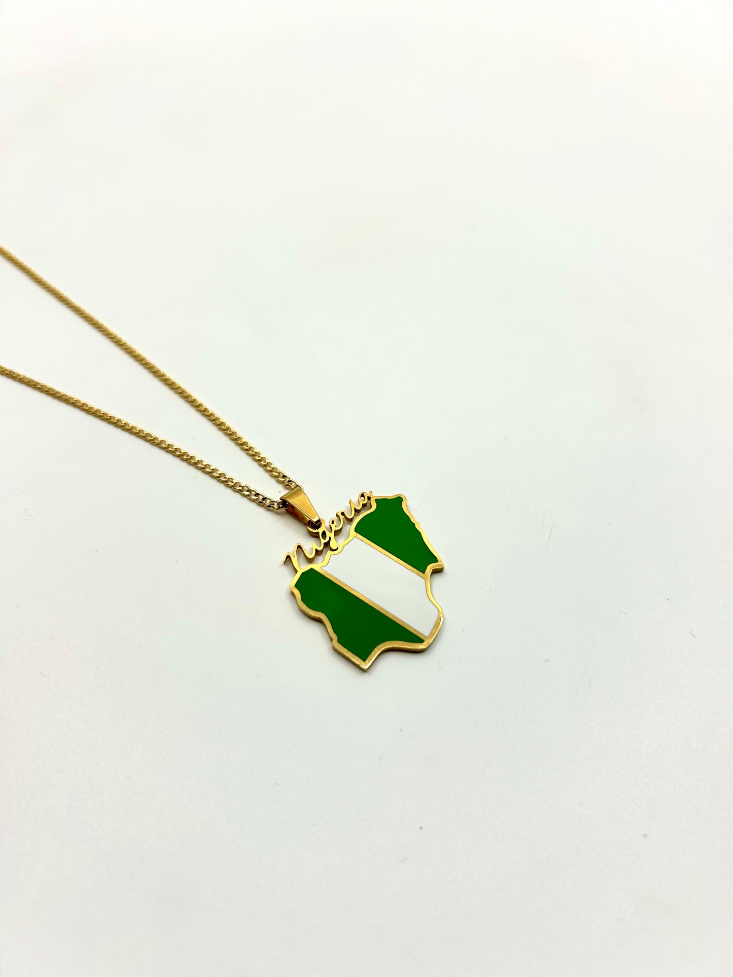 gold-nigeria-map-necklace-flatlay.