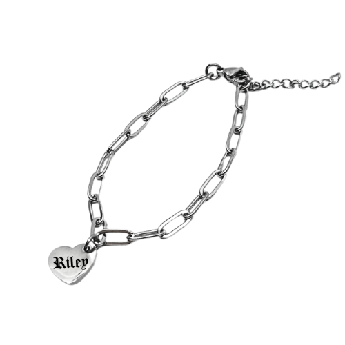 Silver chain bracelet with a heart-shaped tag displaying 'Riley' on a white background