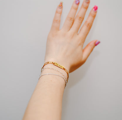 dog mom bracelet on wrist with permanent jewelry
