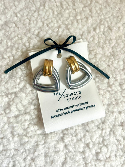 Close-up of chunky silver gold dome earrings – modern vintage jewelry