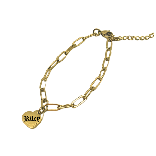 Gold chain bracelet with a heart-shaped tag engraved with 'Riley' on a white background