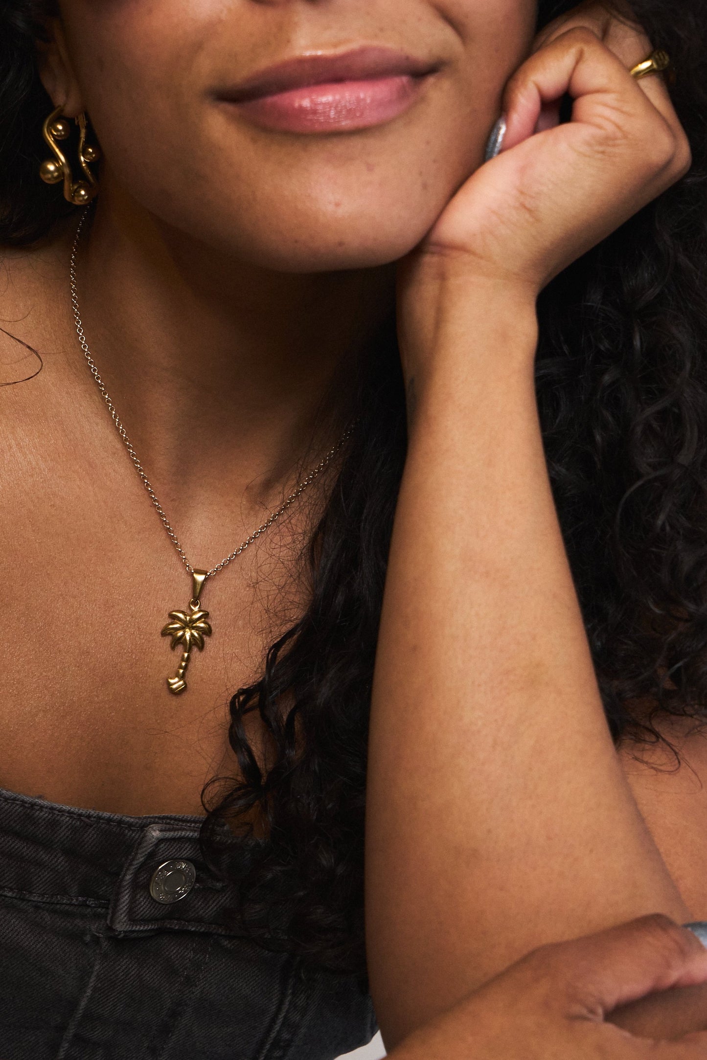 Small gold hoop earrings with beaded texture – waterproof design