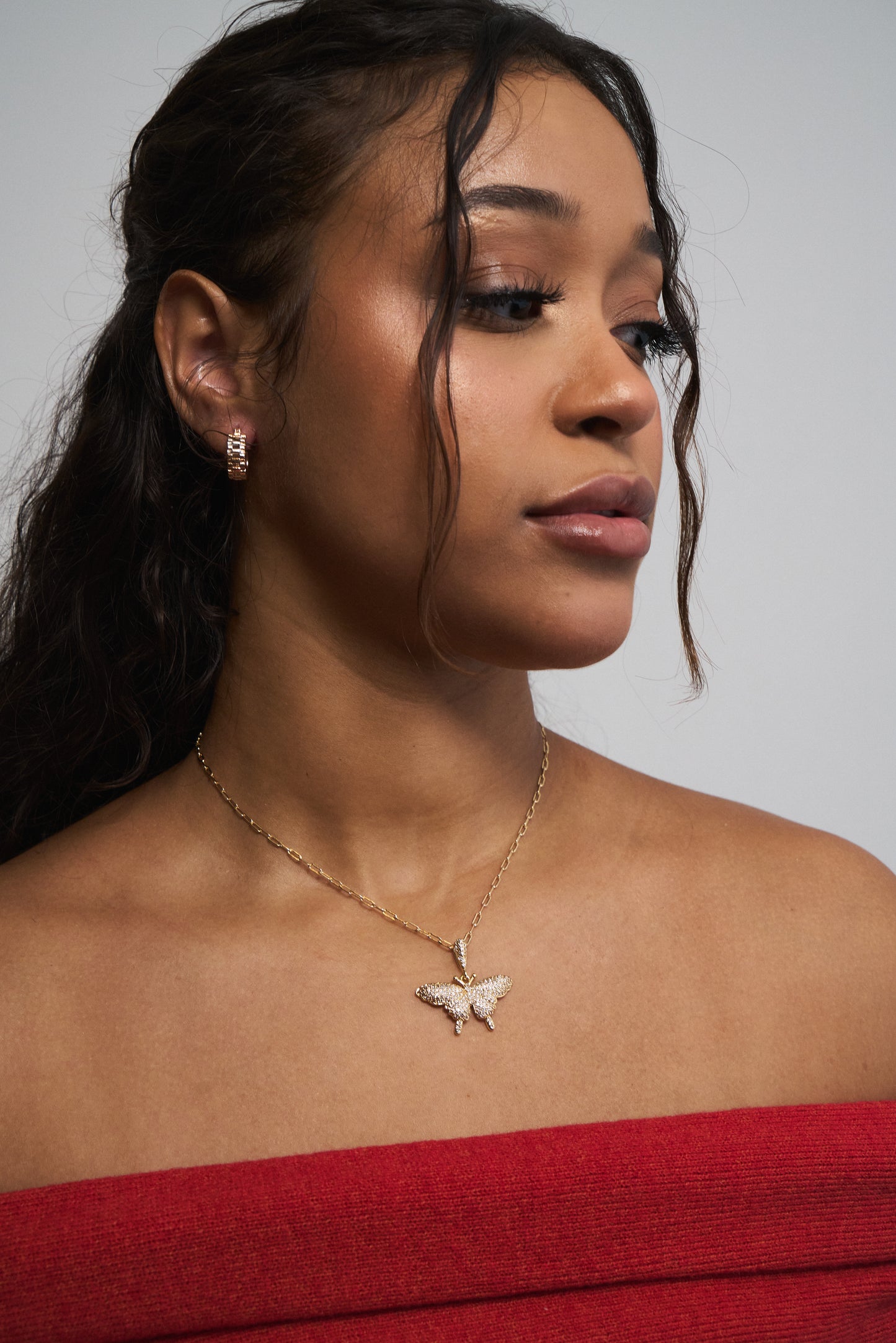 Close-up of mariposa necklace – symbolic gold charm on chain