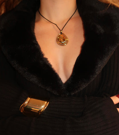 Model wearing circle pendant necklace on black cord – minimalist unisex jewelry