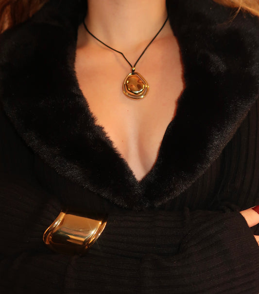 Model wearing circle pendant necklace on black cord – minimalist unisex jewelry