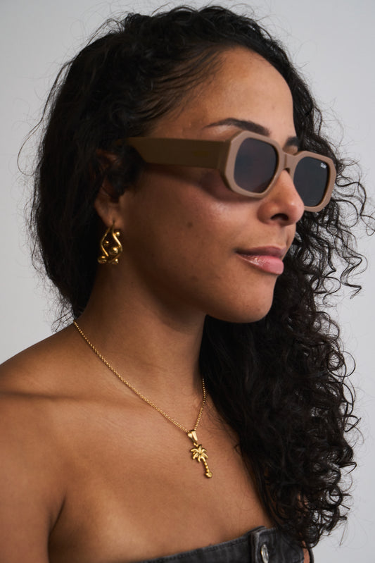 Bolita gold beaded huggie earrings on model – minimalist style