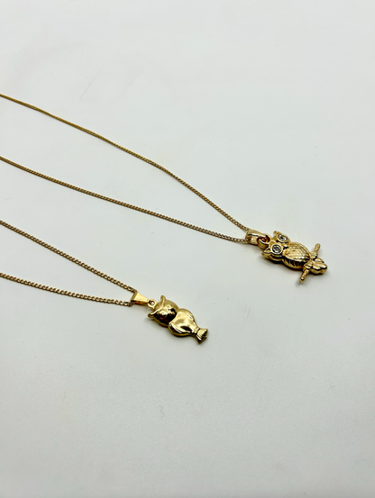 Close-up of owl pendant necklace – gold plated, symbolic jewelry