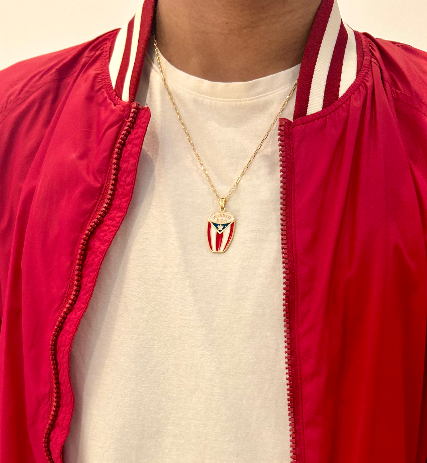 Gold Puerto Rico necklace on model with layered chain