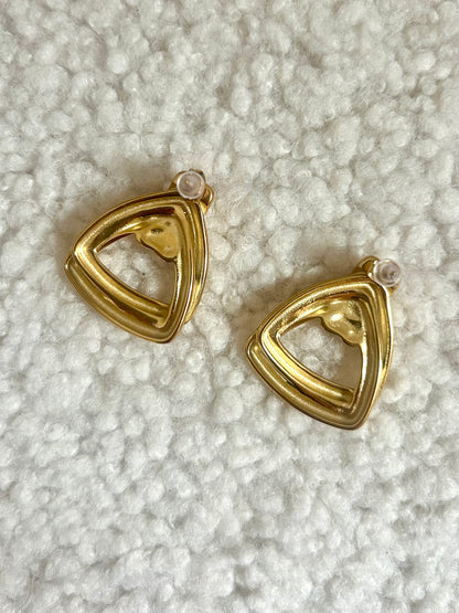 close up of vintage earrings on the back