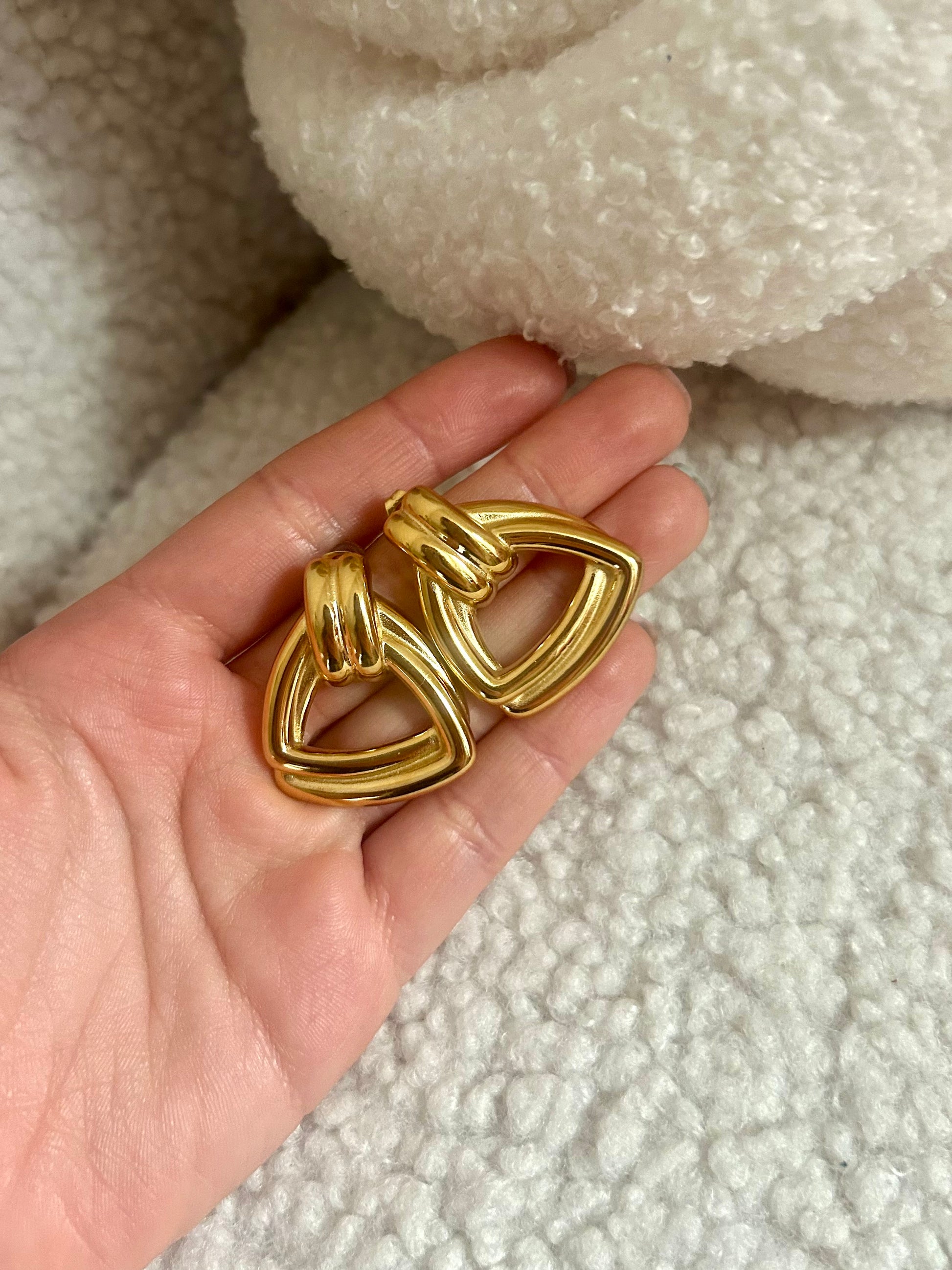Close-up of chunky gold dome earrings – modern vintage jewelry